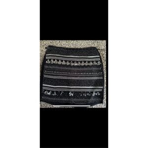 H&M sexy flirty, lightweight black mini with sequins and beads has a slip lining